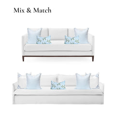 Hofdeco Premium pillow cover placed on patio chair showing outdoor-ready styling benefit
