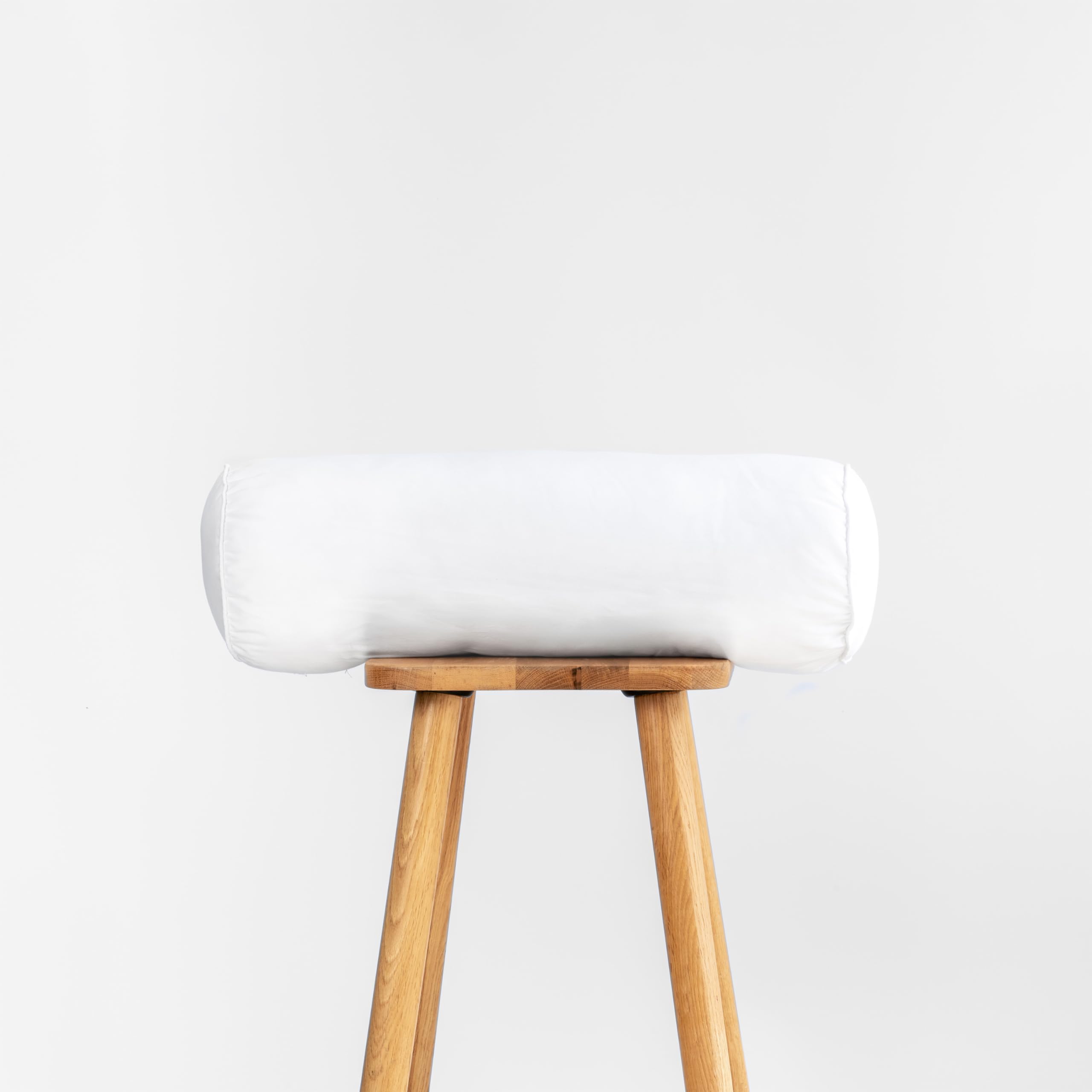 Hofdeco Premium bolster front view showing full shape and crisp edges for stylish seating