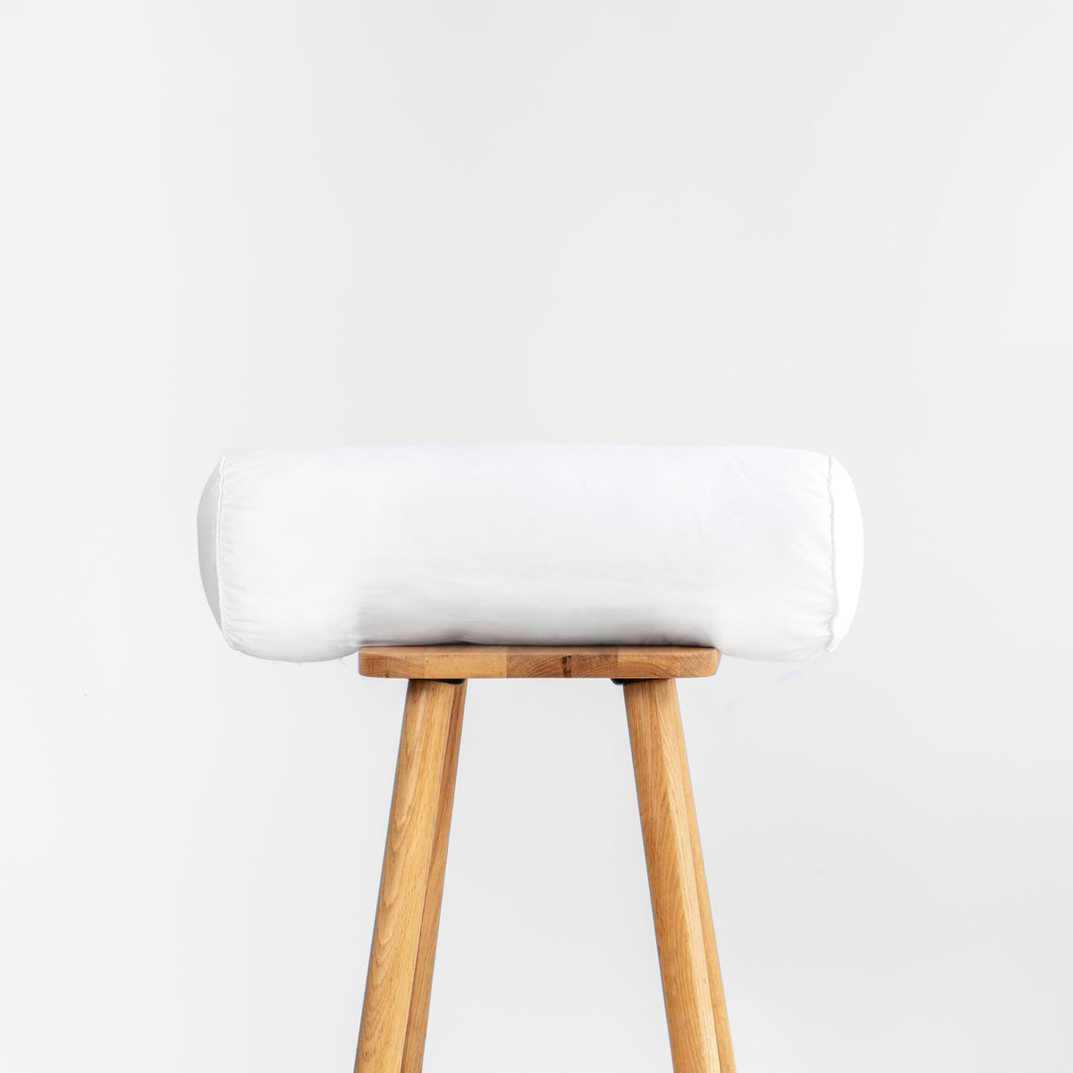 Hofdeco Premium bolster front view showing full shape and crisp edges for stylish seating