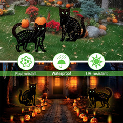 Hokfirm pair of cat stakes placed in a garden bed adding festive Halloween atmosphere