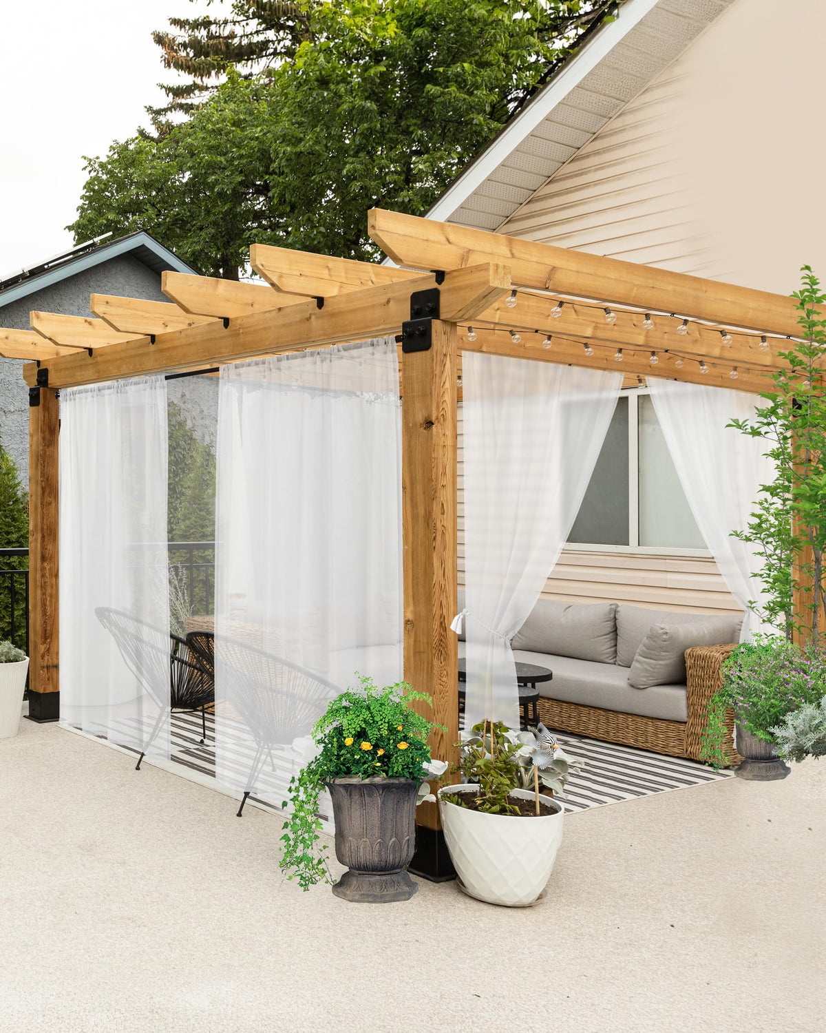 HolidayIdeas front view of six white outdoor sheer curtain panels showing neat packaging and size