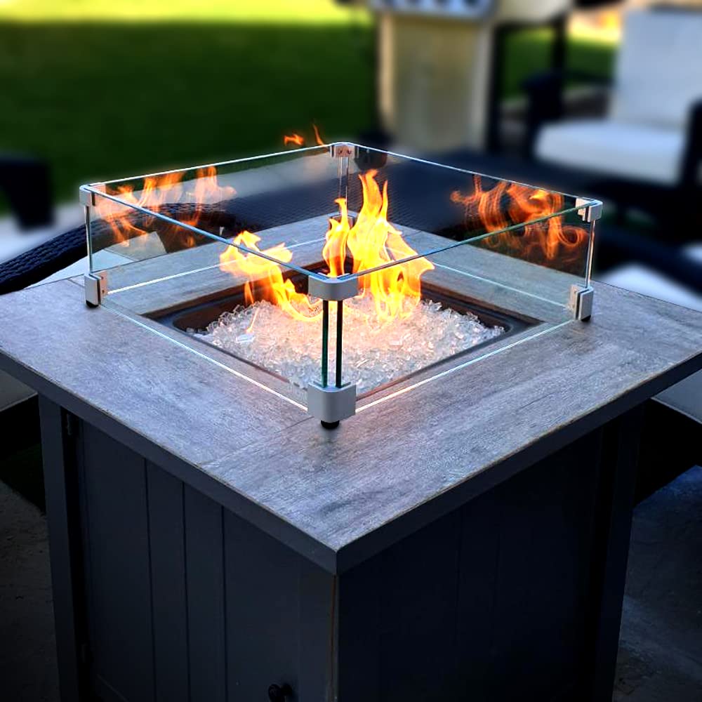 Holy Fire wind guard on patio at dusk creating safer cozy outdoor ambiance