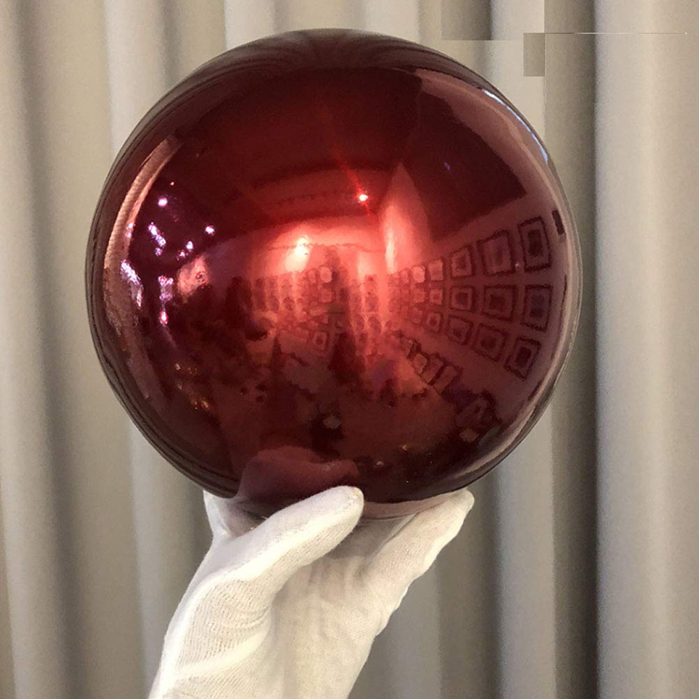 HomDSim 12 inch globe held by hand demonstrating size and portability