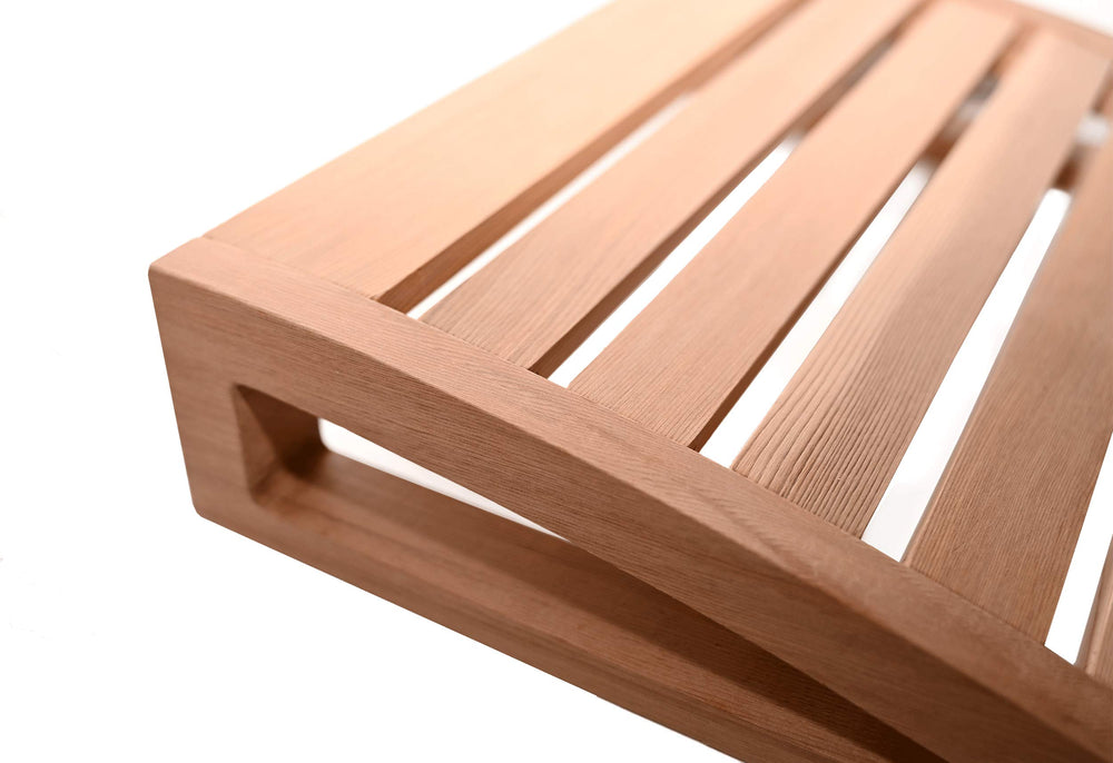 Home Sauna Experience cedar headrest placed on sauna bench illustrating styled setup