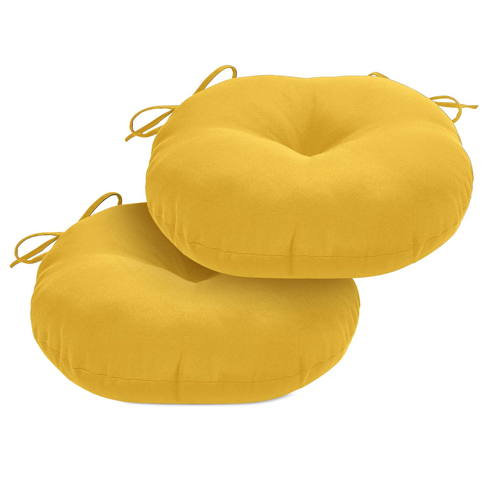 HOMELYSIAN front view of two round cushions showing vibrant yellow and tidy tufting for instant seating upgrade