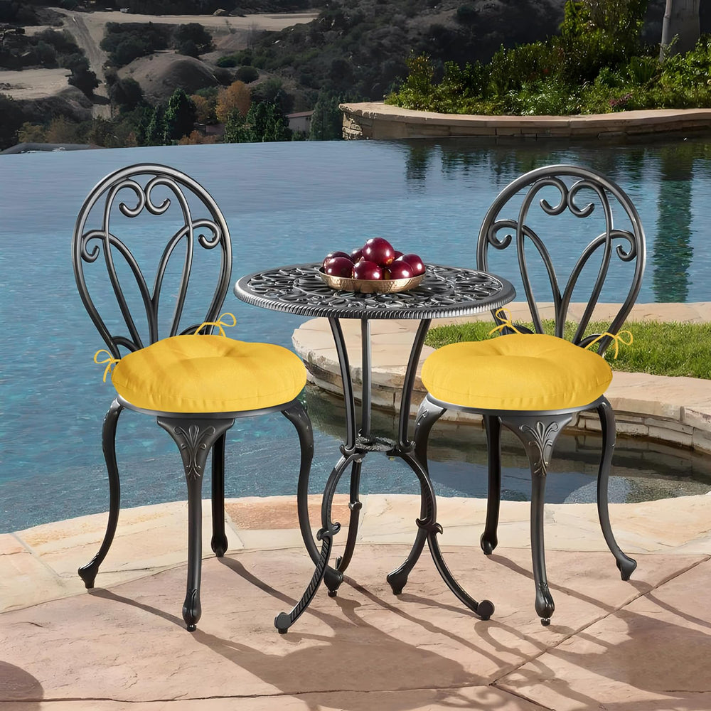 HOMELYSIAN cushions arranged on backyard patio illustrating cheerful color and casual outdoor use