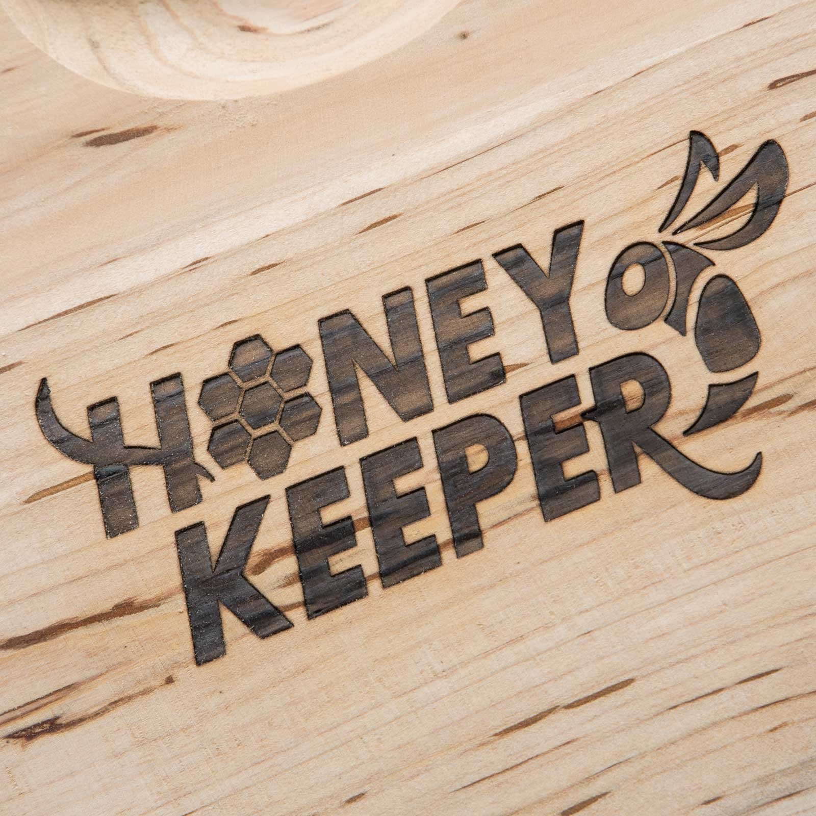 Honey Keeper beekeeper installing frames demonstrating simple inspections and maintenance