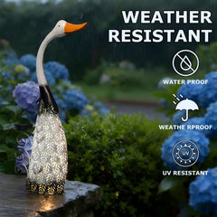 HONGLAND swan placed among flowers adding focal interest to garden