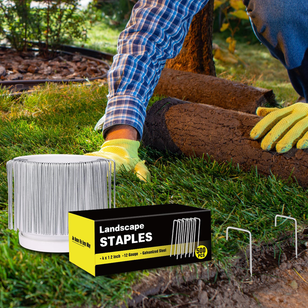 HongWay staples driven into garden soil demonstrating strong ground hold