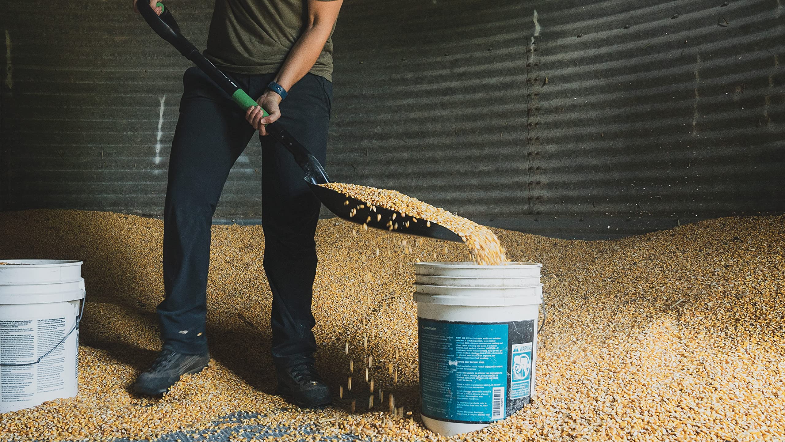 Hooyman shovel in use moving grain illustrating efficient bulk handling