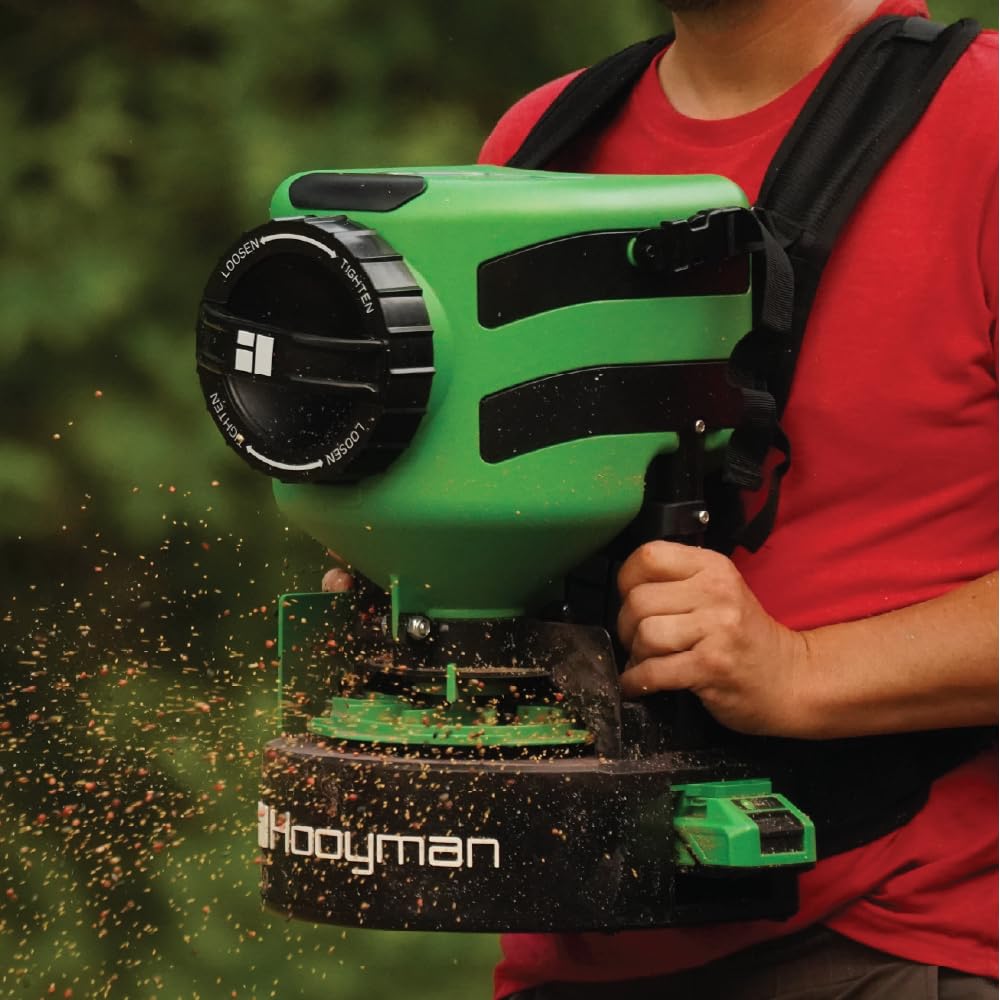 Hooyman spreader in use on lawn reducing labor and improving distribution