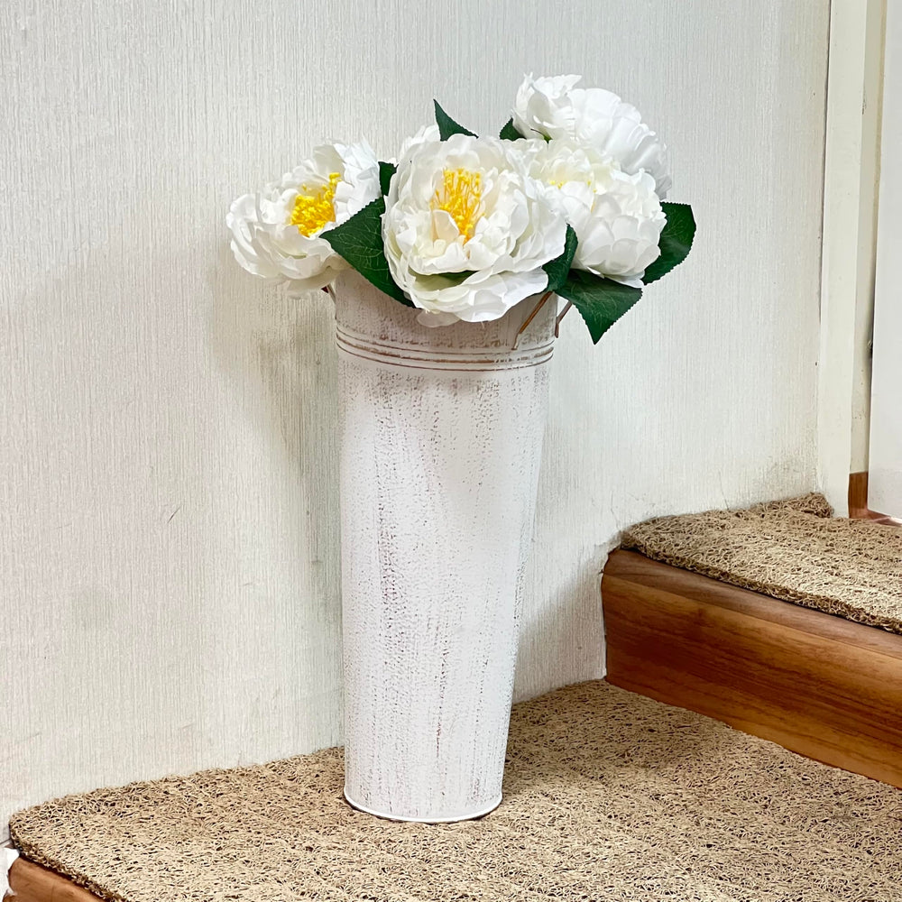 Hosley arranged on a rustic table creating coordinated event decor