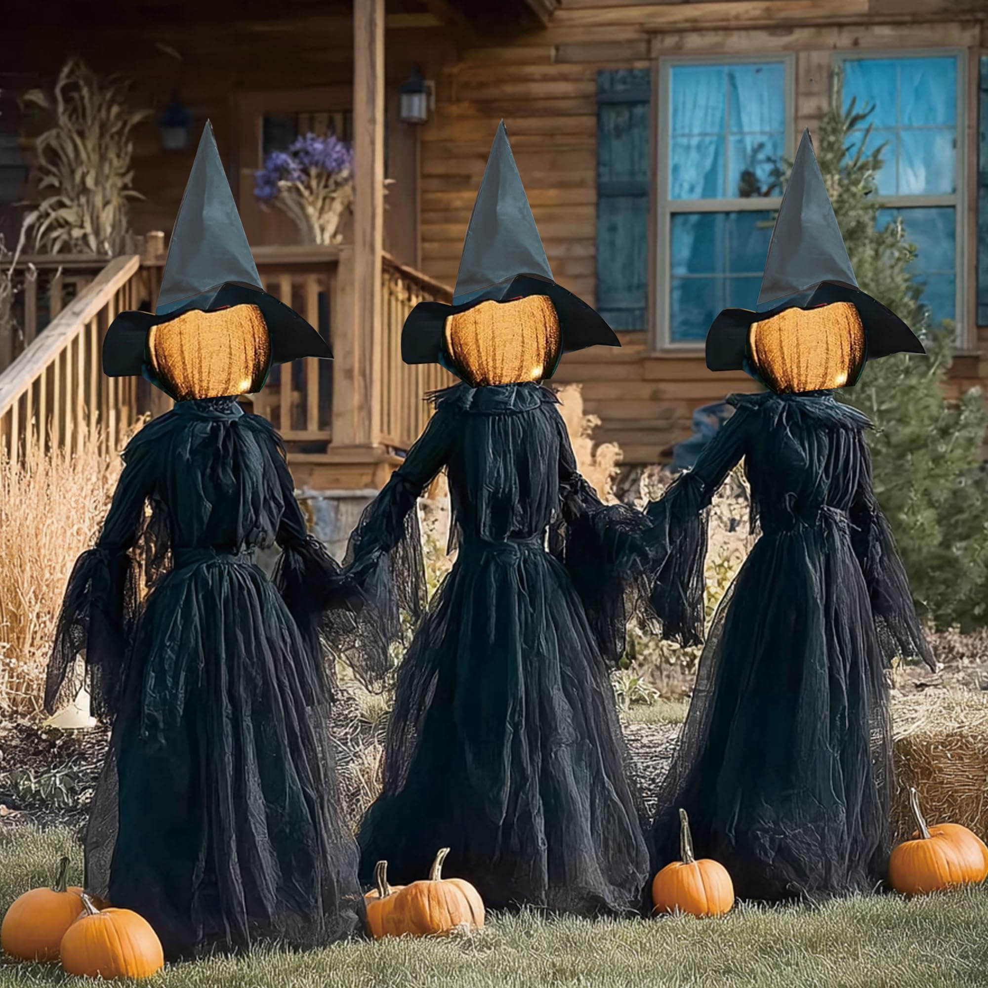 Hourleey front view of three lighted witches showing spooky yard impact