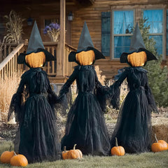 Hourleey front view of three lighted witches showing spooky yard impact
