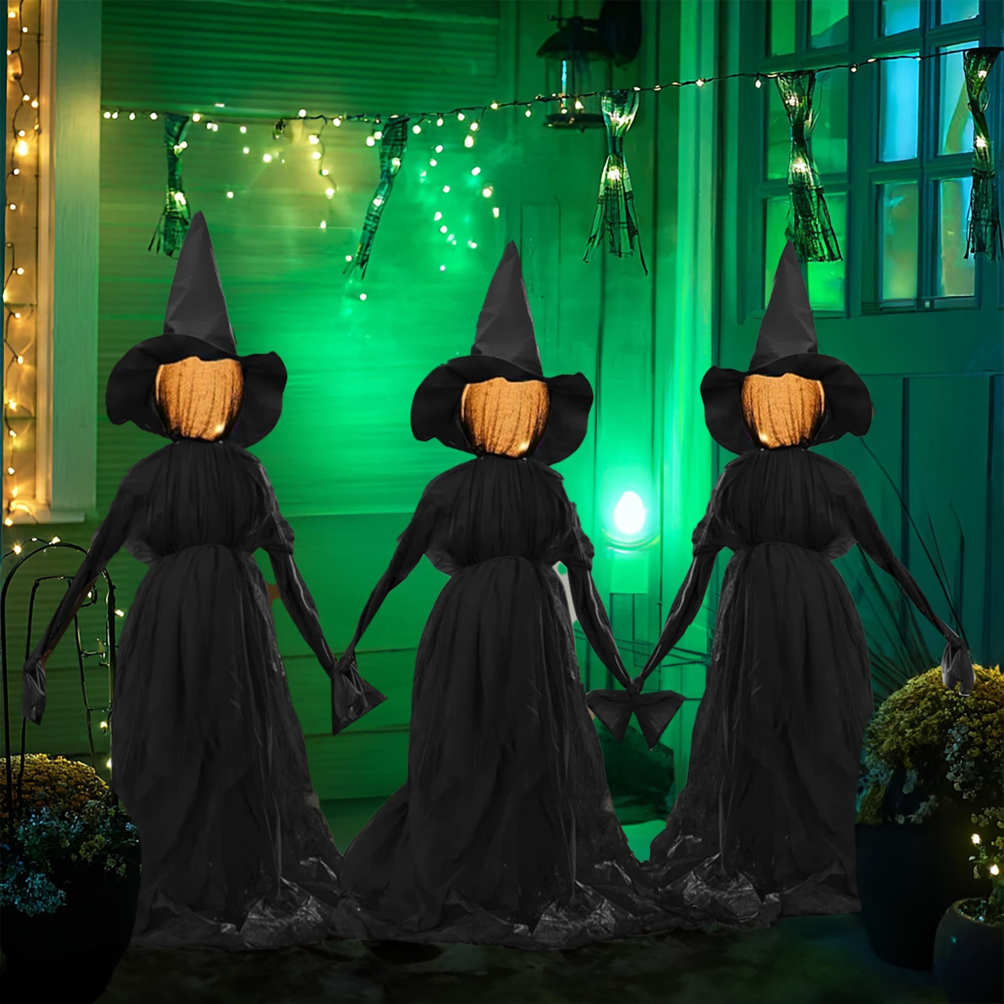 Hourleey nighttime yard scene with holding-hands witches creating atmosphere