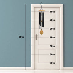 Howarmer wind chime hanging on porch creating calming soundscape benefit for outdoor relaxation