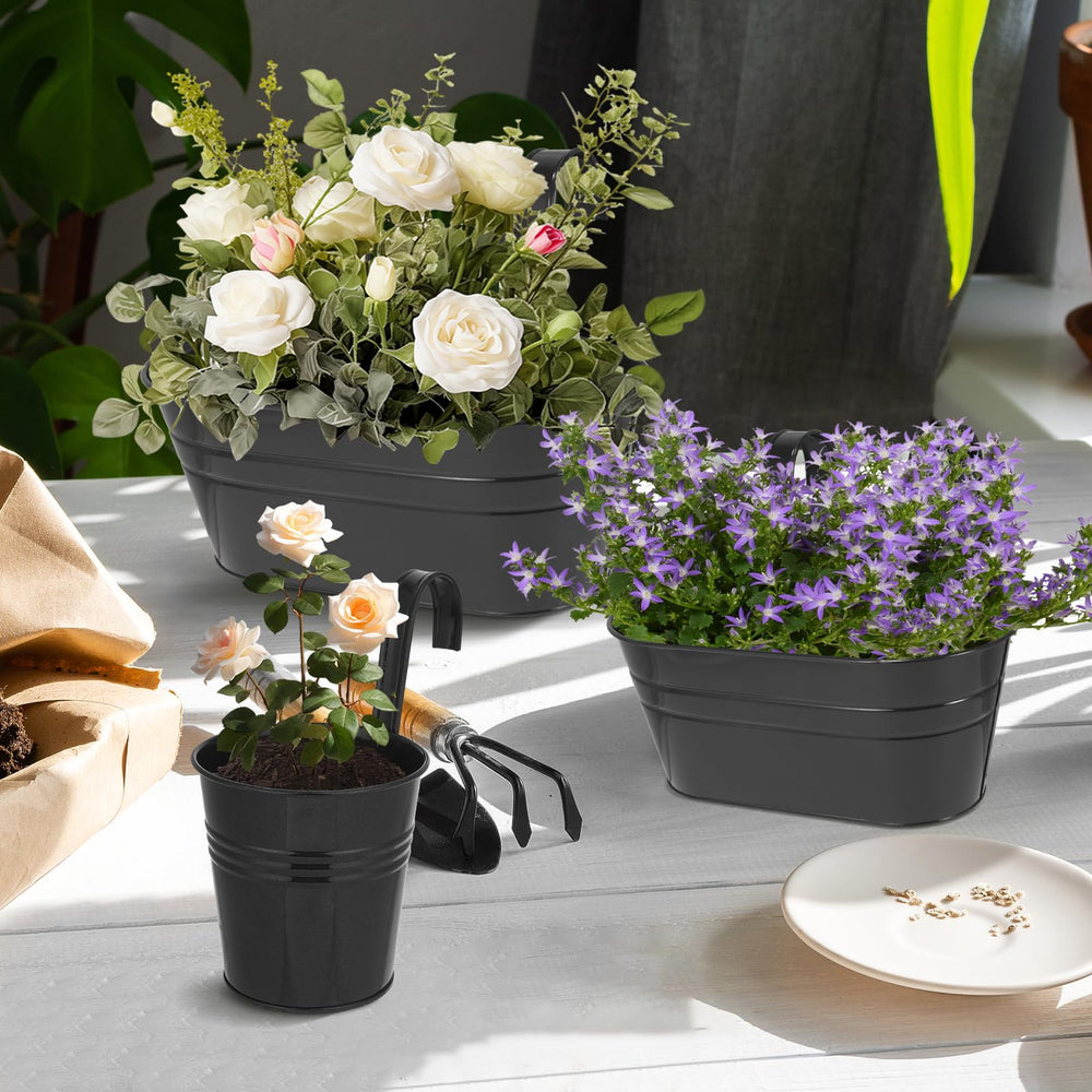 HowRU hanging pots in use on a balcony with lush plants for visual appeal