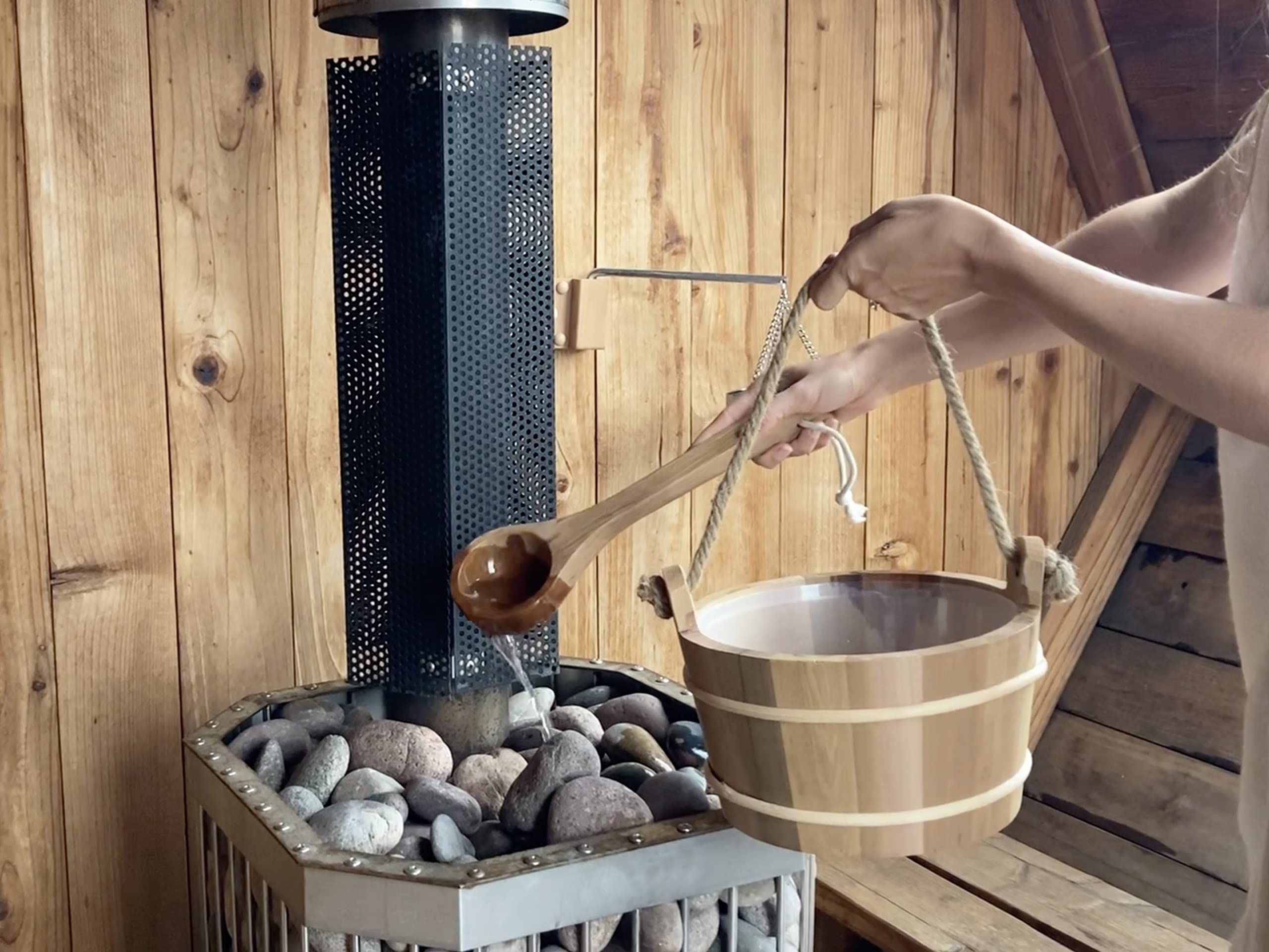 Home Sauna Experience cedar bucket beside water bottle to show 4L capacity