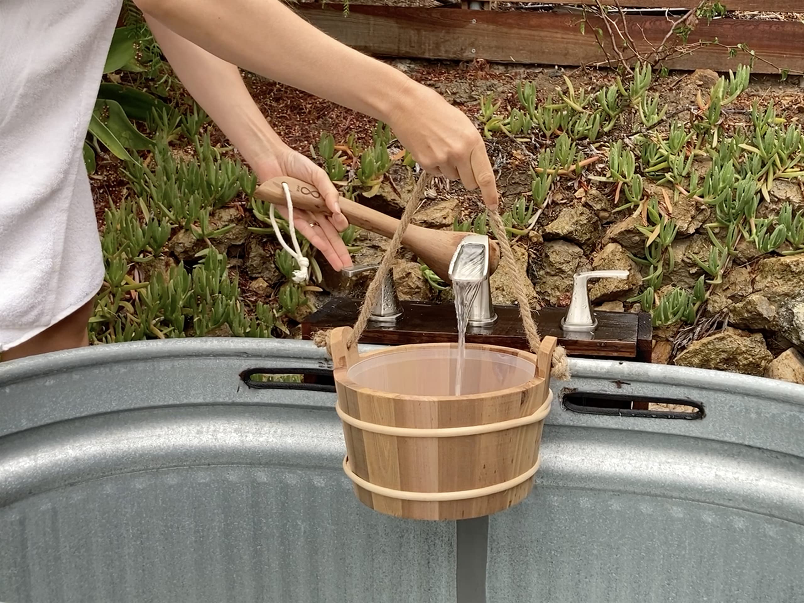 Home Sauna Experience cedar bucket hanging by rope handle for easy drying