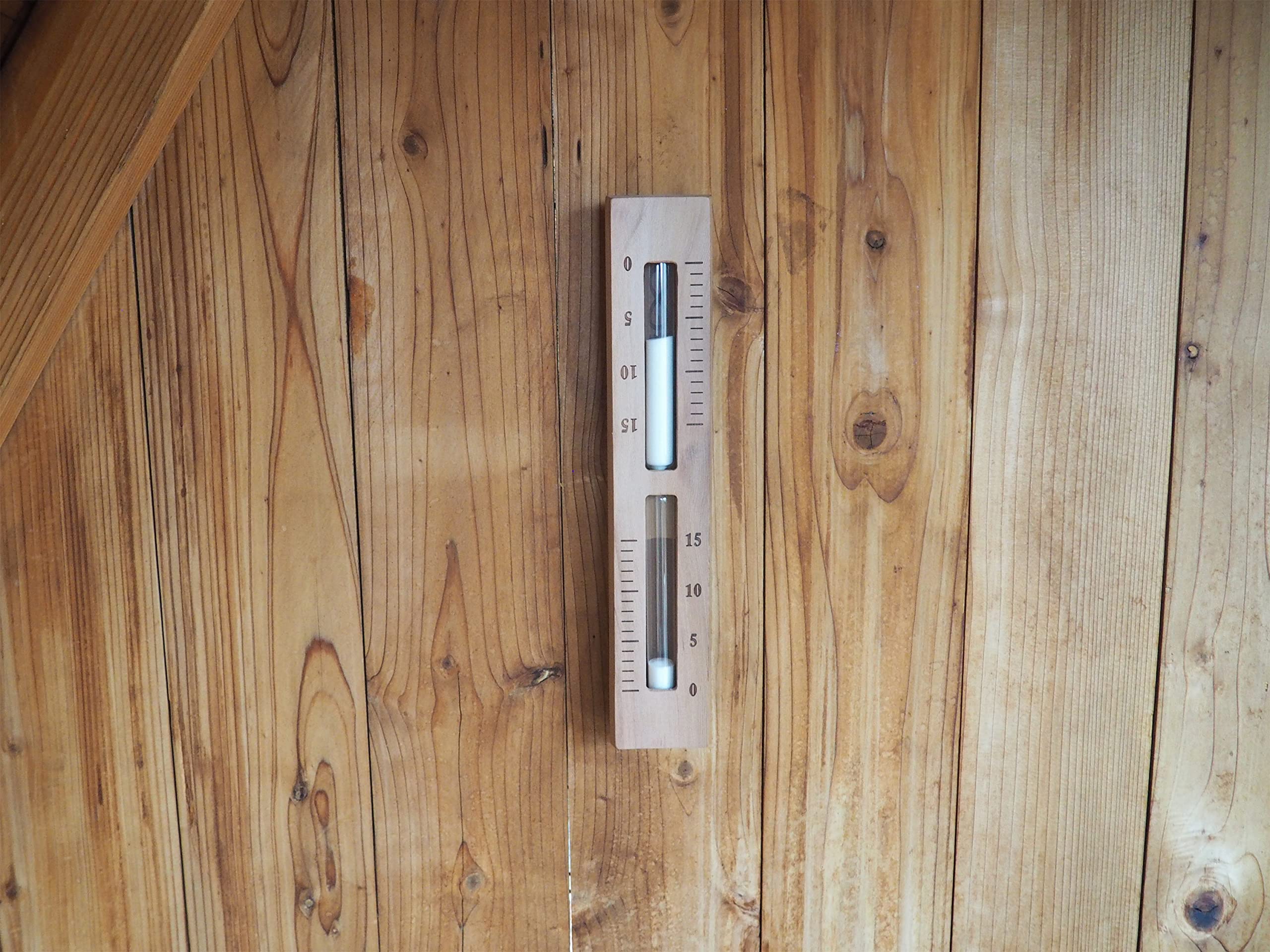 Home Sauna Experience hourglass closeup showing white bead sand and clear timing