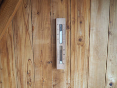 Home Sauna Experience hourglass closeup showing white bead sand and clear timing
