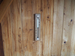 Home Sauna Experience mounted timer displaying hidden hardware and seamless wall aesthetic