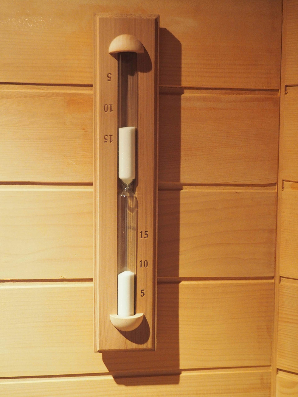 Home Sauna Experience rotating action image showing timer flipped easily for quick session starts