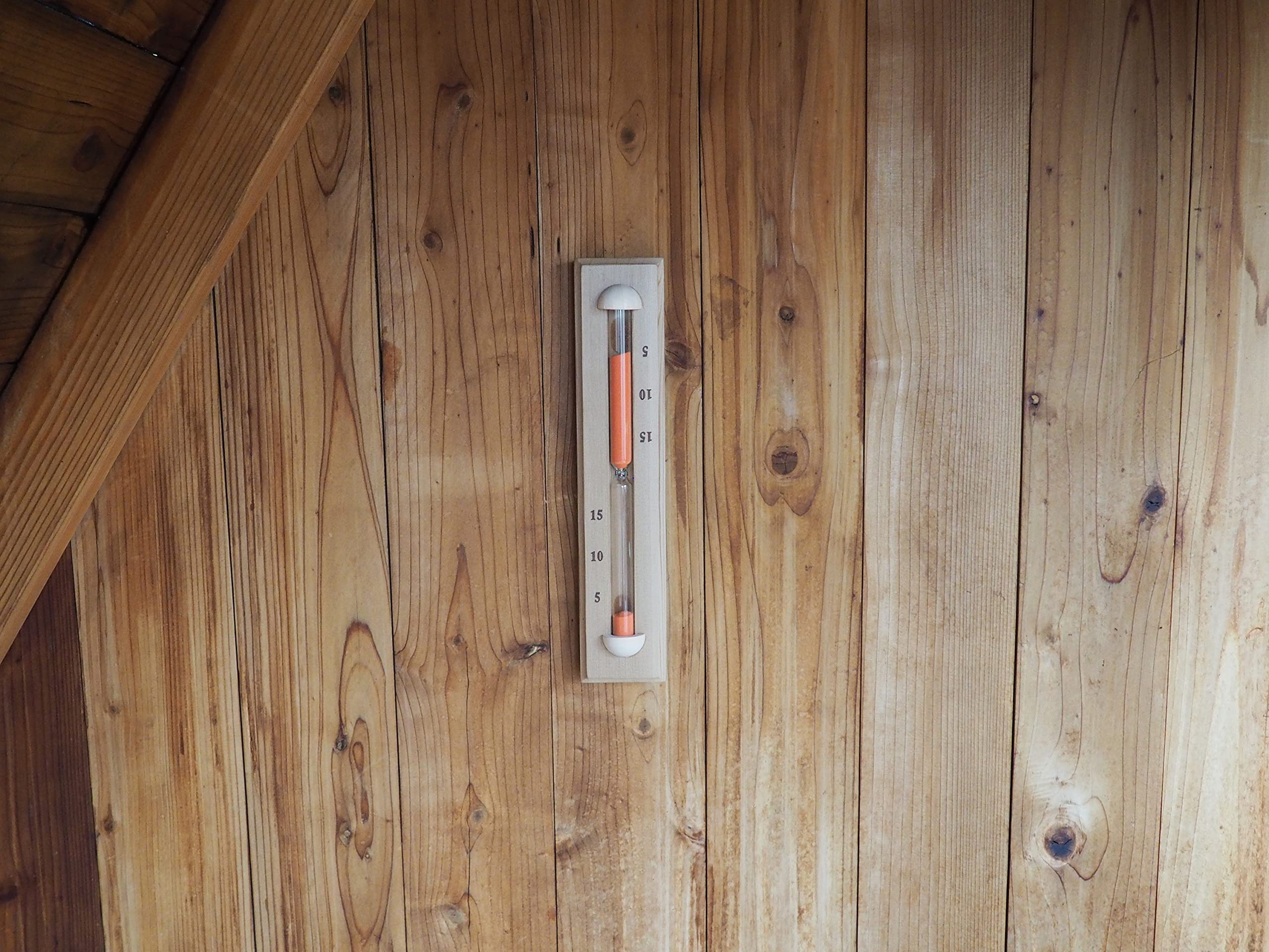 Home Sauna Experience close-up of rust red sand flowing for clear visible timing benefit
