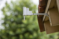 Hunter WRCLIK attached to exterior wall highlighting tool-free mounting benefit