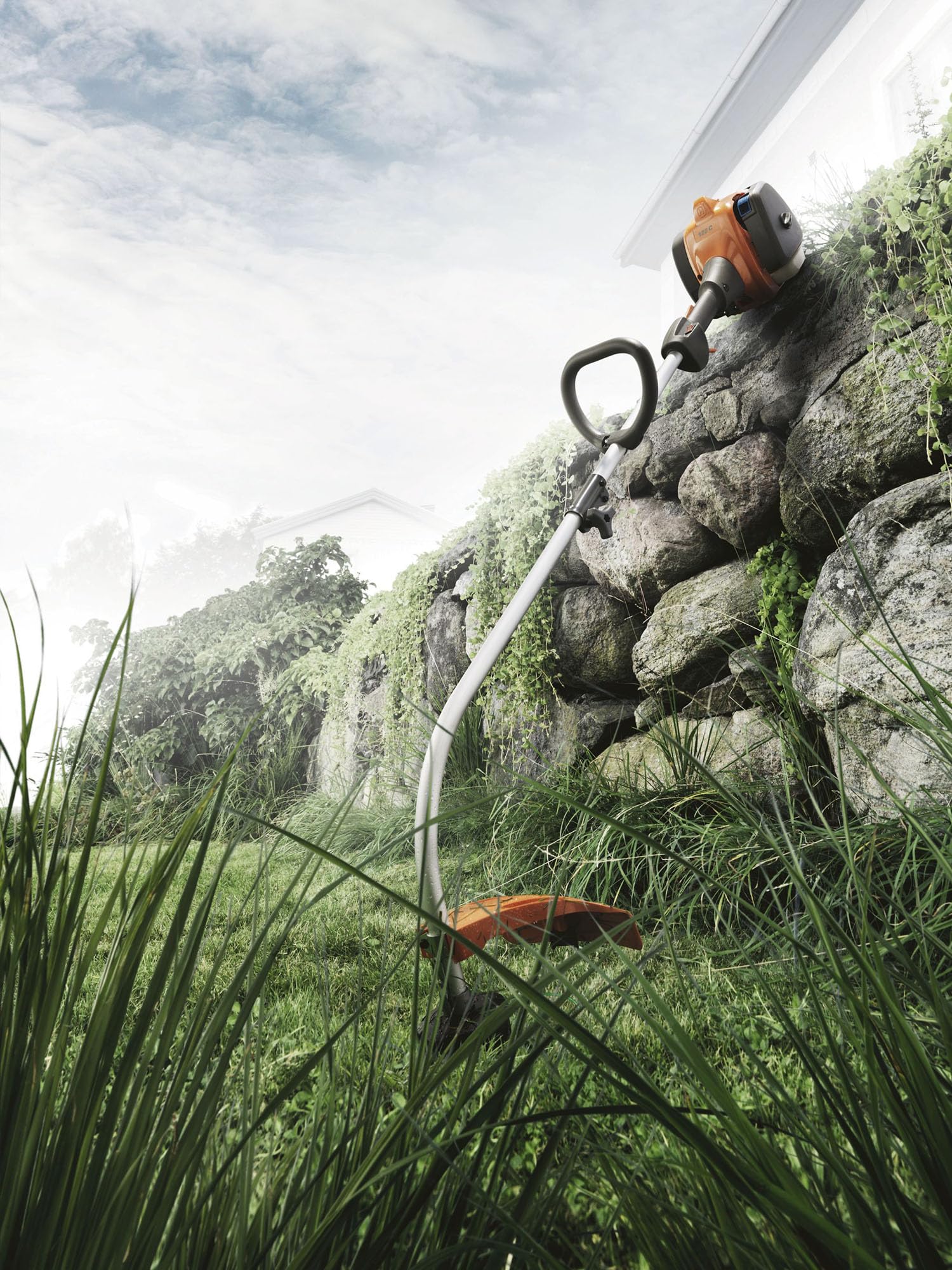 Husqvarna next to a ruler showing scale and lightweight handling benefit