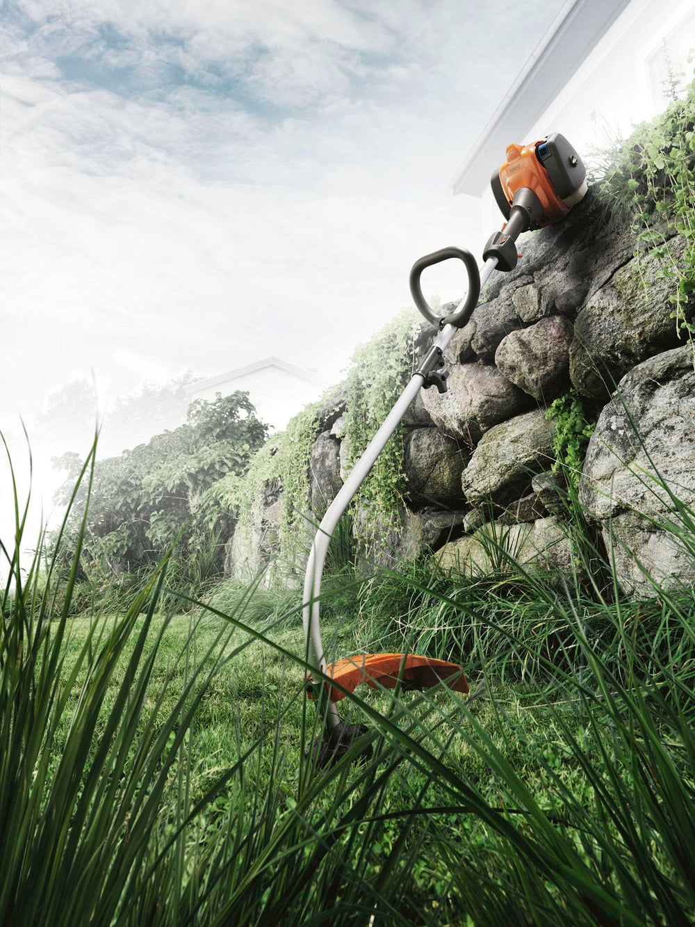 Husqvarna next to a ruler showing scale and lightweight handling benefit