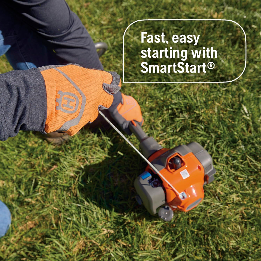 Husqvarna trimmer next to person for scale showing comfortable reach advantage
