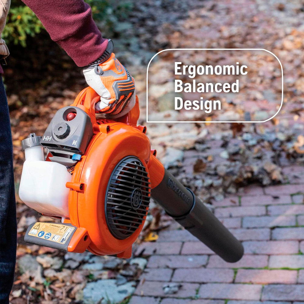 Husqvarna 125B clearing a flowerbed without disturbing plants