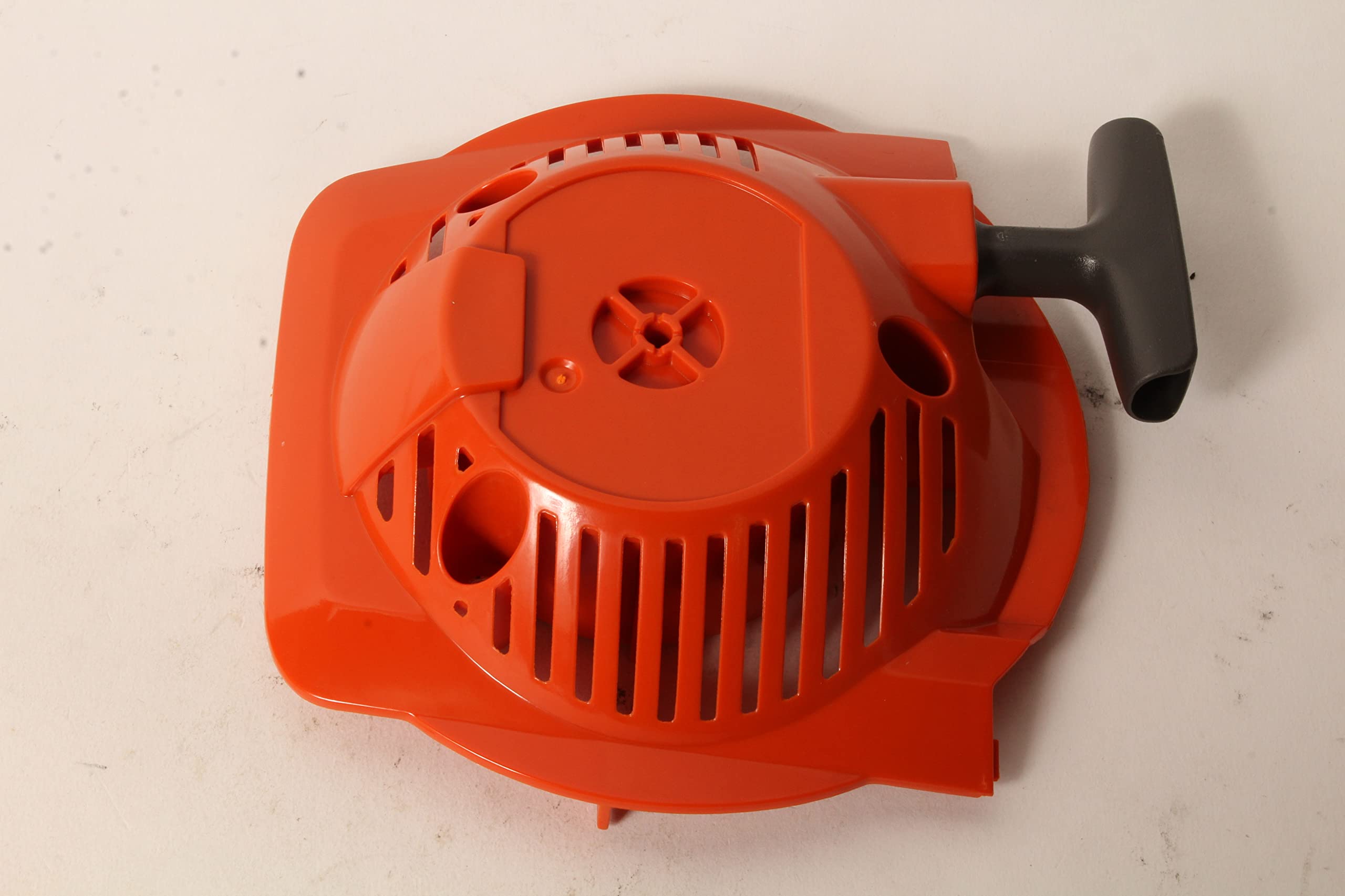 Husqvarna starter rope and handle detail showing ergonomic grip and secure pull