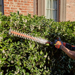Husqvarna B140 battery shown separately offering balanced runtime and light weight for homeowners