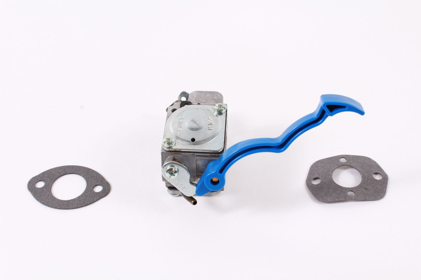 Husqvarna carburetor beside ruler to show scale and easy identification