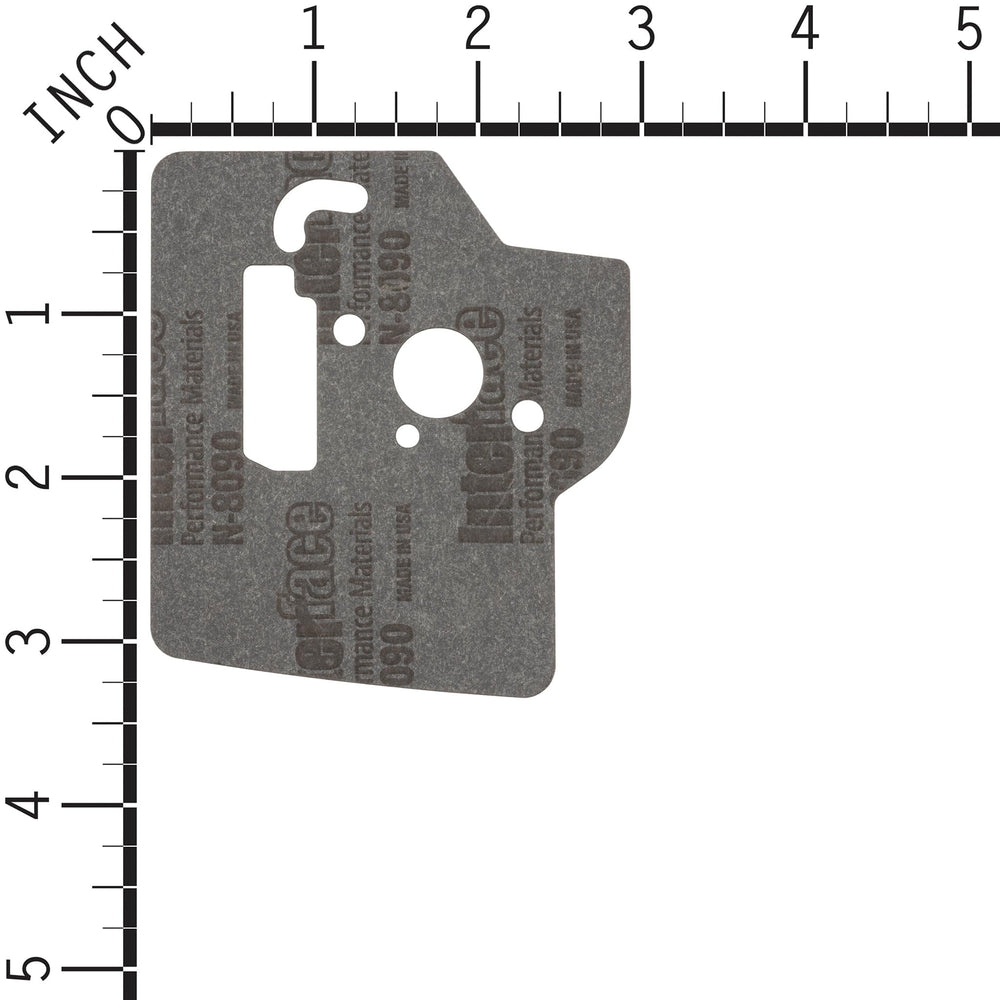 Husqvarna carburetor next to ruler for scale to verify correct sizing