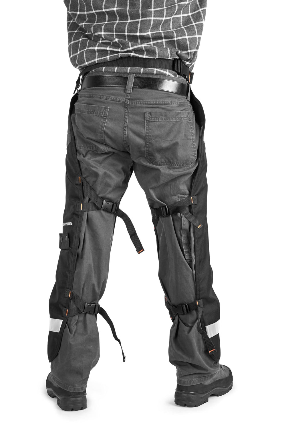 Husqvarna chaps worn by operator cutting firewood demonstrating protection and mobility