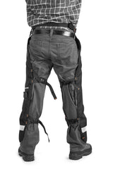 Husqvarna chaps worn by operator cutting firewood demonstrating protection and mobility