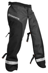 Husqvarna front apron chaps laid flat showing full coverage and durable finish for safety