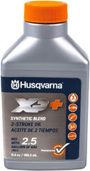 Husqvarna bottle pouring into fuel container demonstrating clean mix benefit