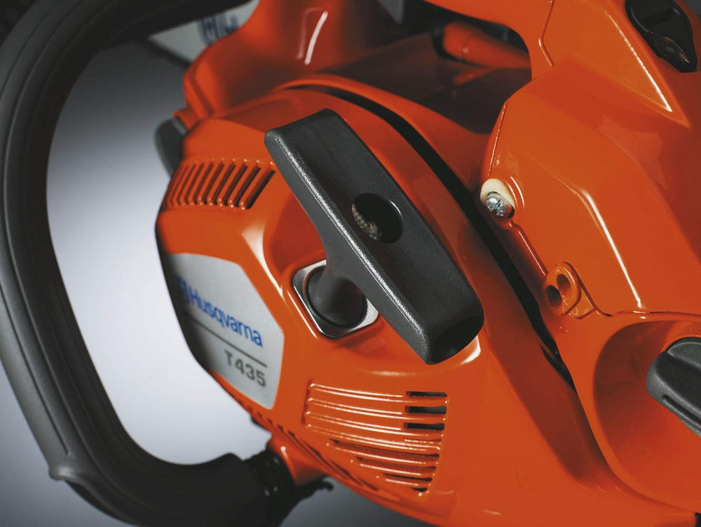 Husqvarna T435 side detail highlighting controls and side chain tensioning for quick adjustments