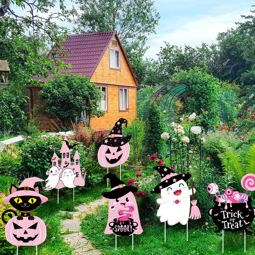 Huwena signs used on a party table adding festive pink Halloween atmosphere