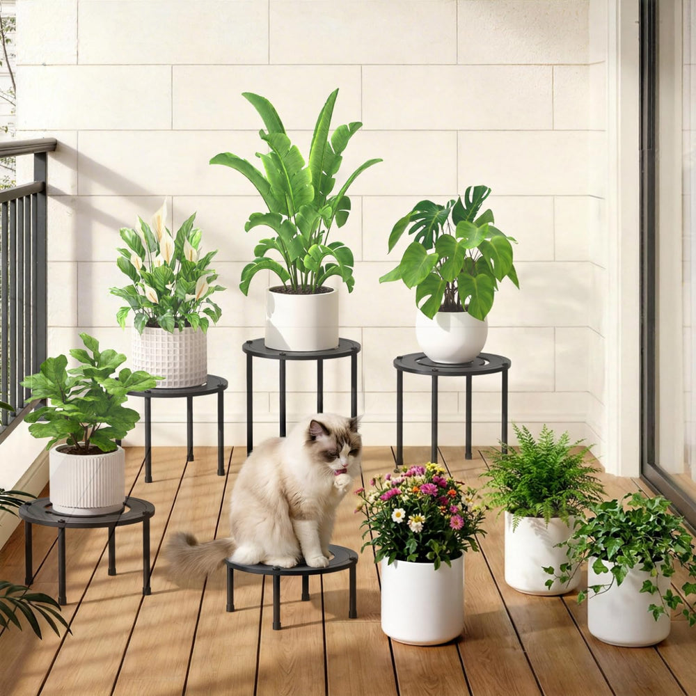 iDavosic.ly stand holding a heavy planter to illustrate 130 lb weight capacity