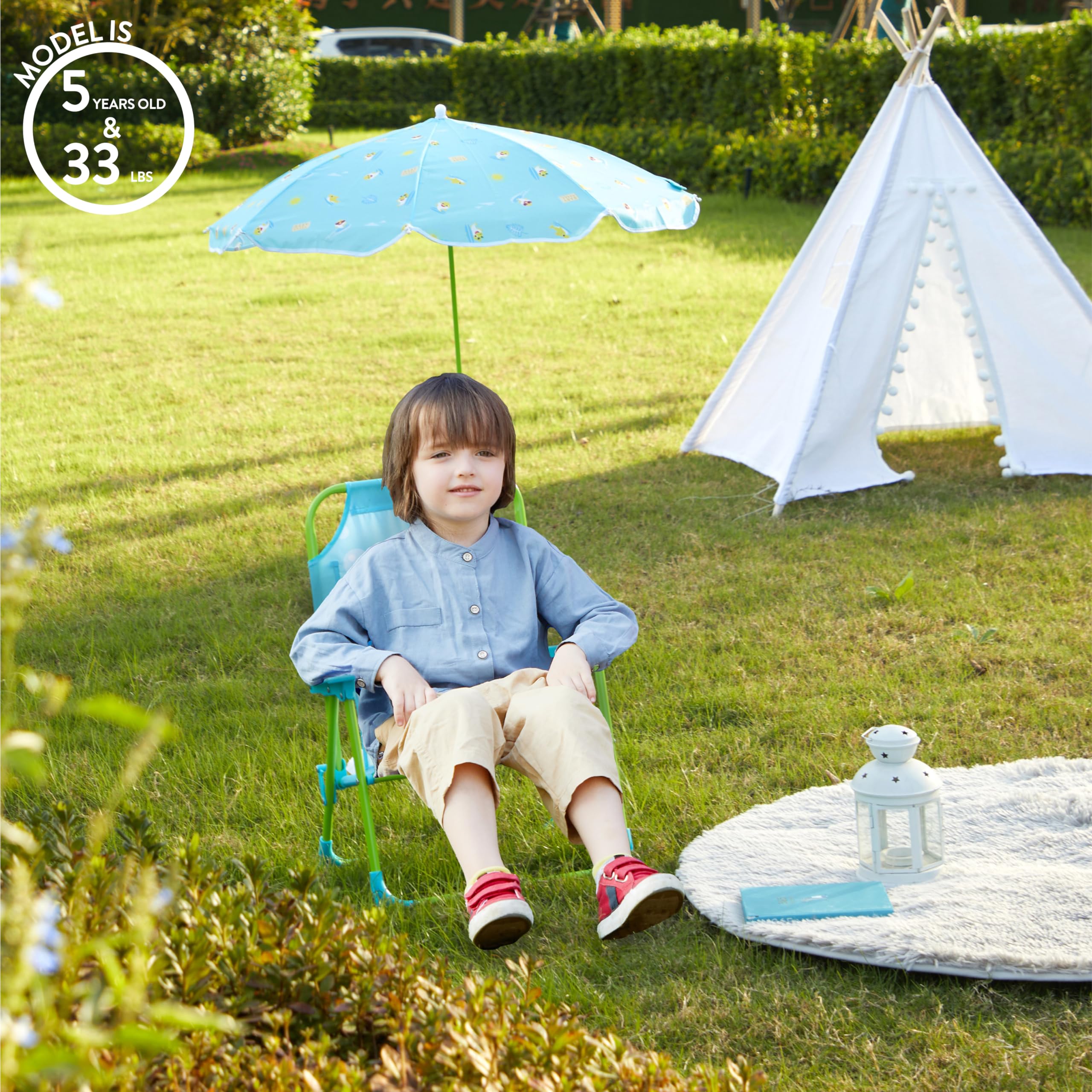 Idea Nuova chair in use at the beach with child seated, convenience and shade