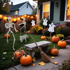 IDEAALS lit caretaker and hound at night creating dramatic curb appeal benefit