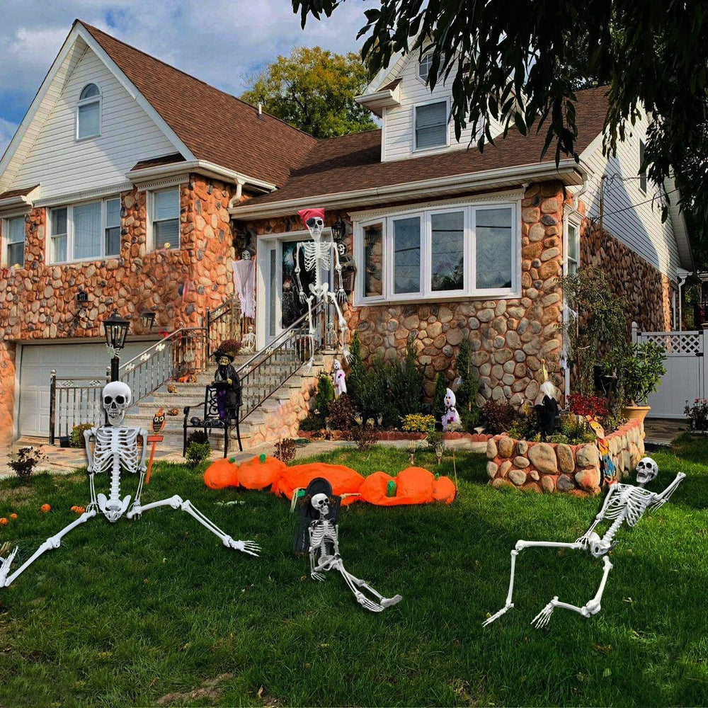 IDMOP yard scene at night with skeleton and lights showing atmospheric Halloween impact
