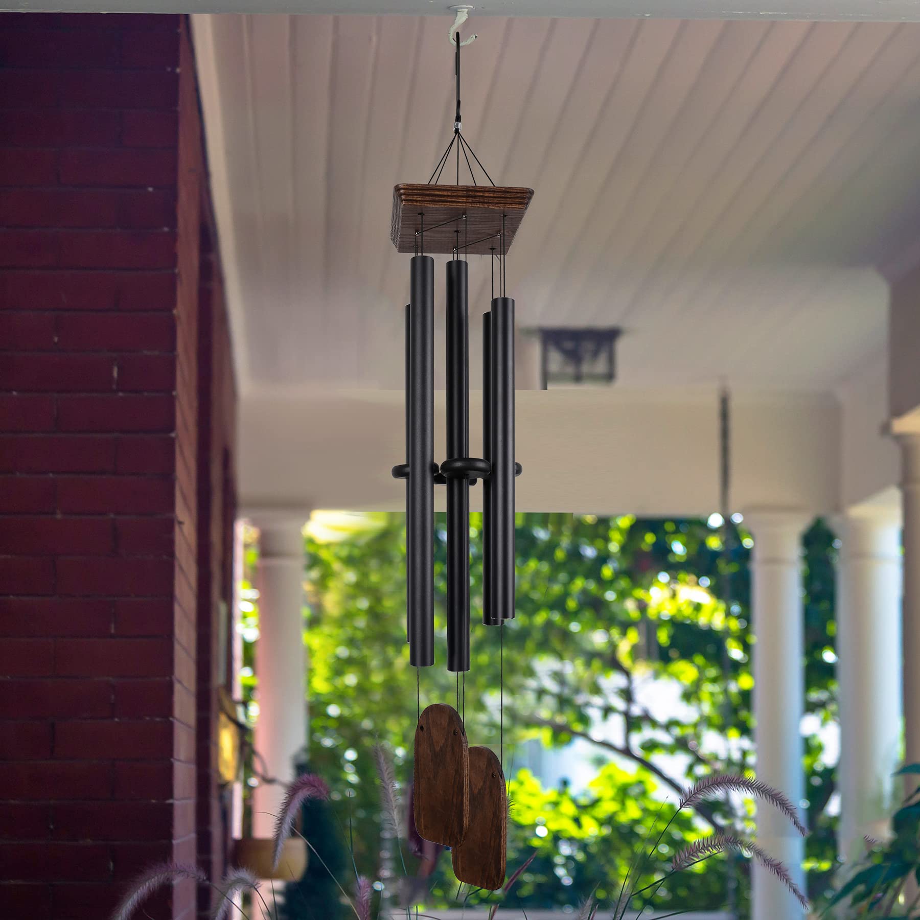 Implication hanging on a porch illustrating outdoor placement and soothing acoustic benefit