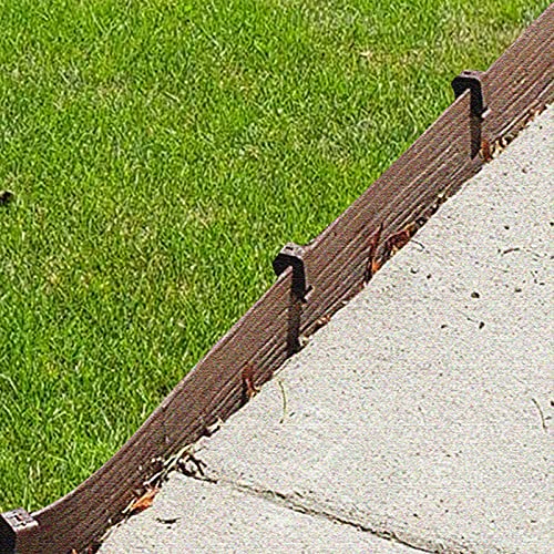 Inslat stakes securing artificial turf edge to prevent lifting and movement