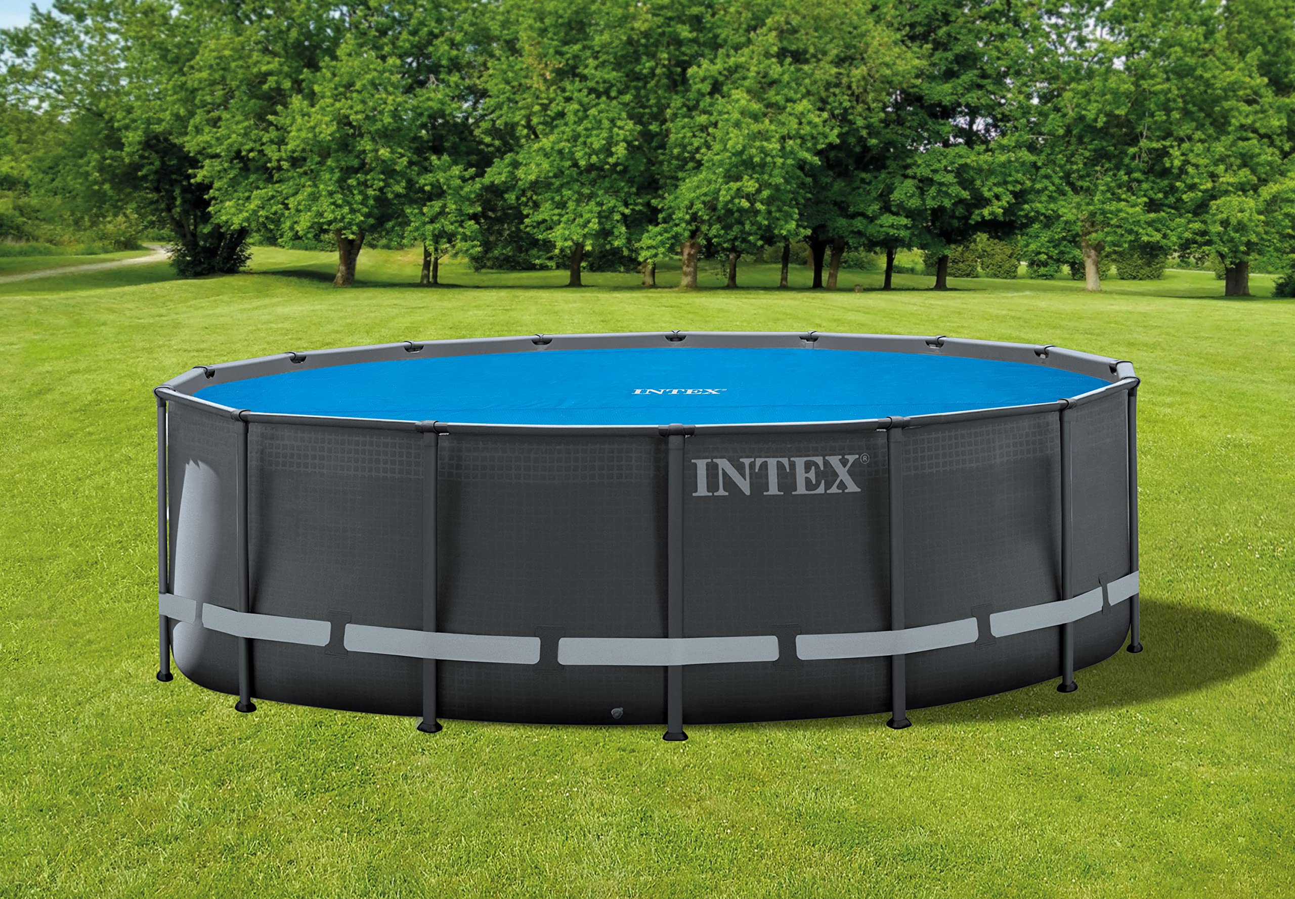 Intex cover floating on 16ft pool demonstrating debris protection benefit